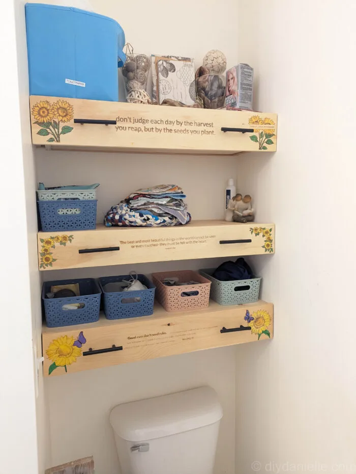 Completed DIY wooden drawers with small storage baskets on open shelves, showcasing a clean and organized finish.