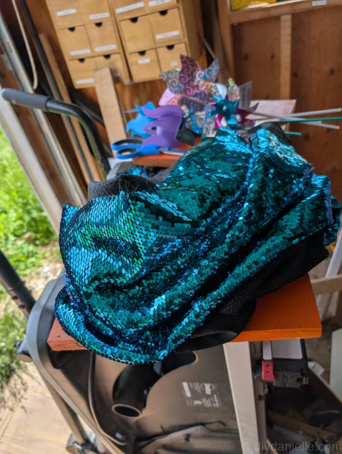 DIY fidget board made with reversible sequin fabric, ideal for sensory play and calming therapy use.