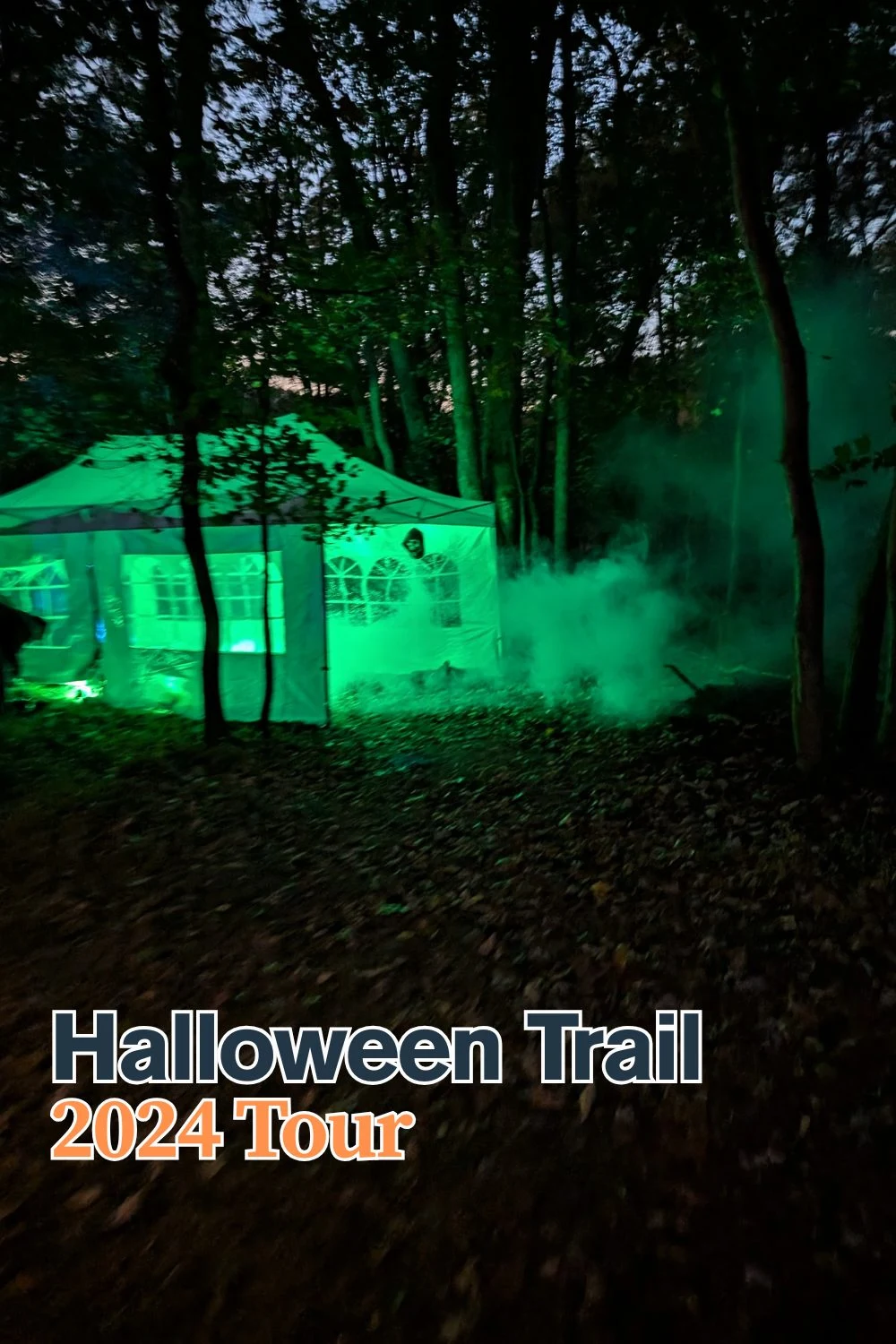 Outdoor Halloween trail with spooky decorations, fog, and laser effects, perfect for 2024 Halloween.
