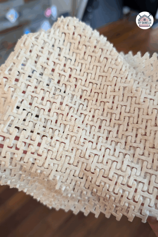 Close-up of 3D printed fabric-style fidget with chainmail texture, designed for sensory input and quiet fidgeting