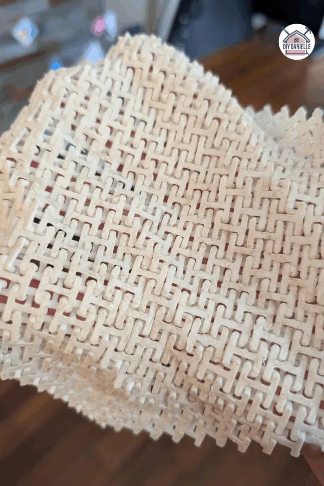 Close-up of 3D printed fabric-style fidget with chainmail texture, designed for sensory input and quiet fidgeting