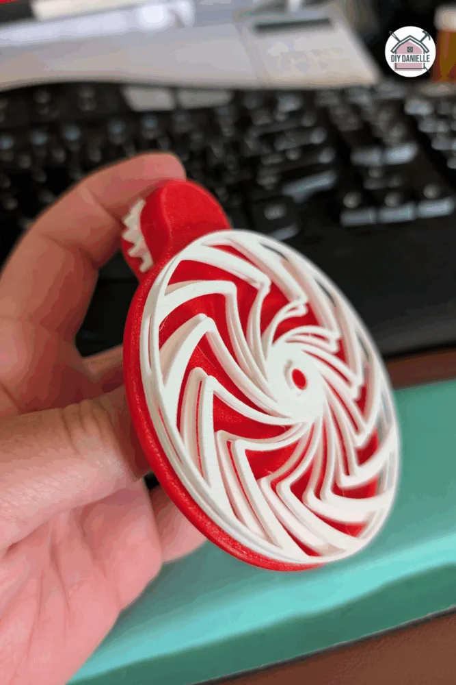Large 3D printed kinetic spinner fidget designed for desk use and stress relief through spinning