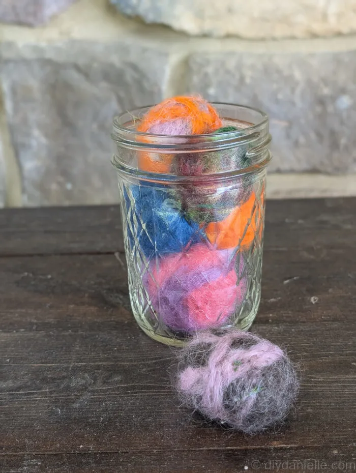 Homemade cat toys filled with homegrown catnip on a wooden surface, perfect for playful cats