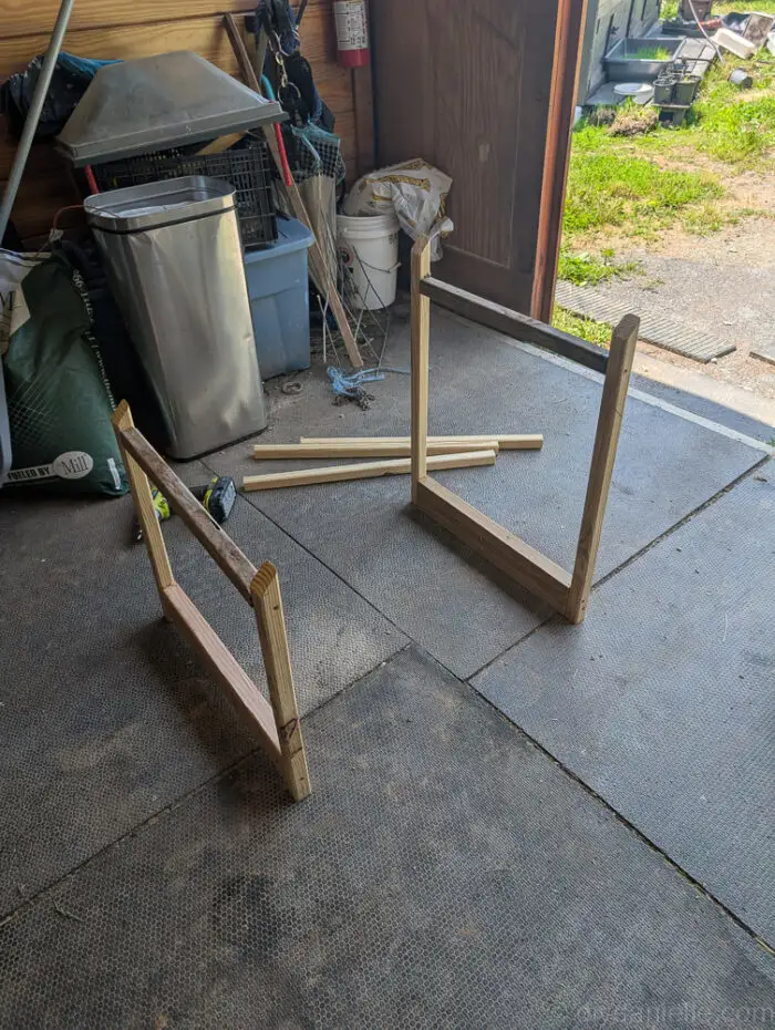 Measuring and building a 2x2 wooden frame with angled cuts for an outdoor litter box cover.