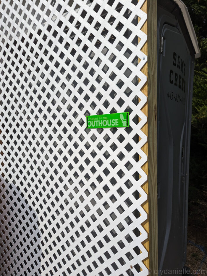 Close-up image of a wooden privacy screen showing frame structure and diagonal supports.