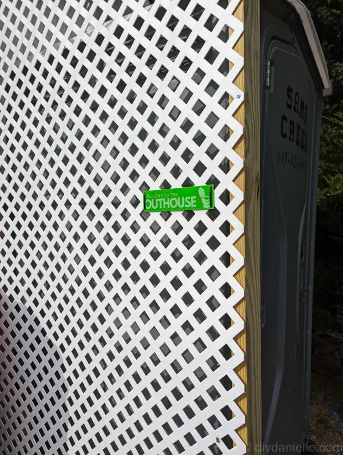 Close-up image of a wooden privacy screen showing frame structure and diagonal supports.