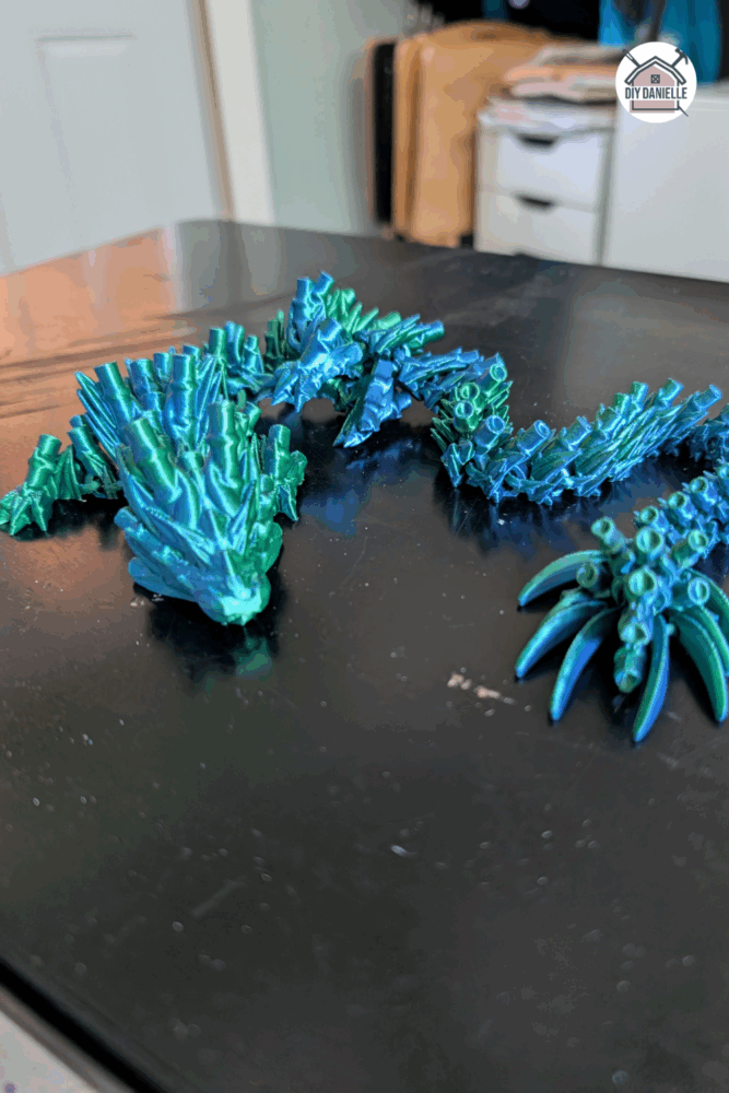 Articulated 3D printed dragon toy with flexible, jointed body, ideal for sensory play and light fidgeting
