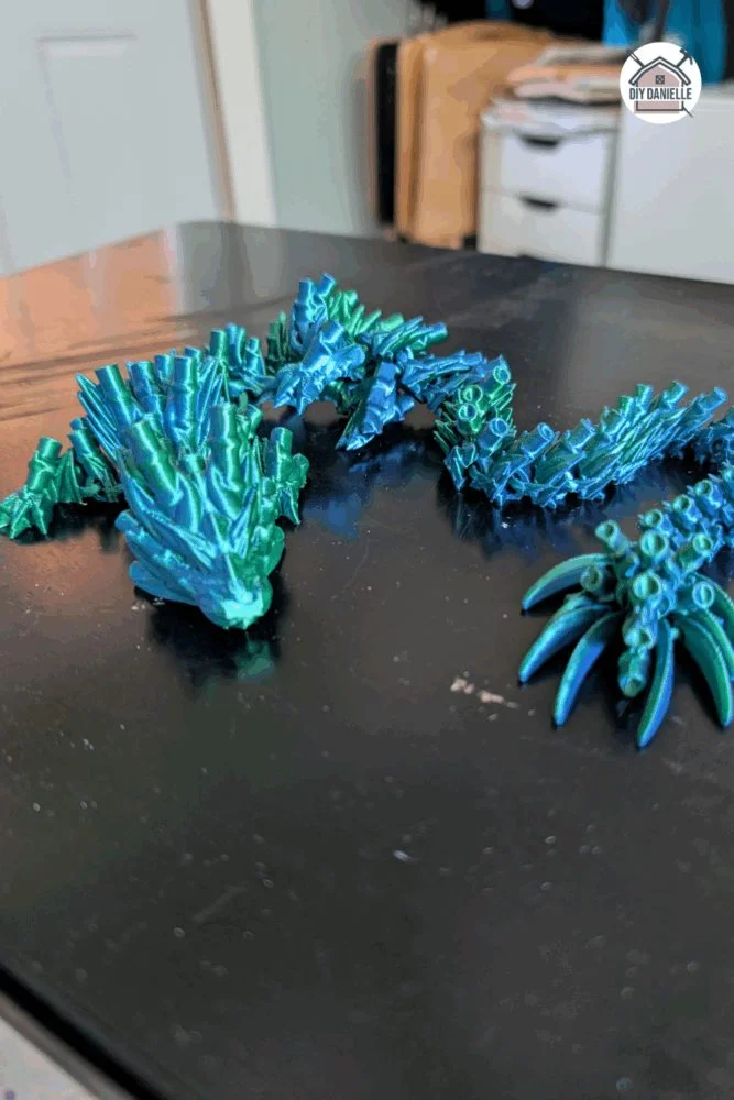 Articulated 3D printed dragon toy with flexible, jointed body, ideal for sensory play and light fidgeting