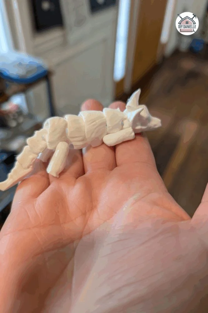 3D printed flexible dire wolf toy designed as a quiet sensory fidget with movable joints