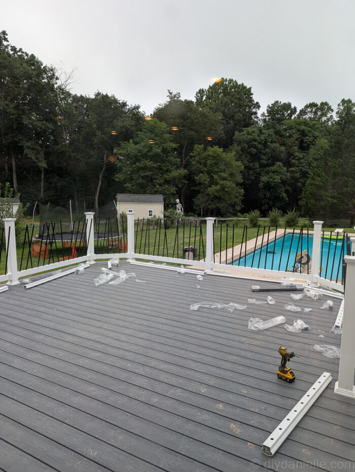 View of the deck with railing posts going in, nearing completion.