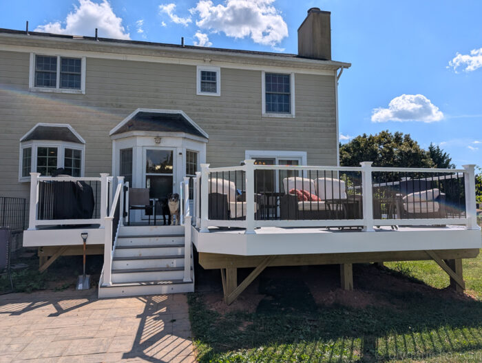 View from the patio highlighting the furniture arrangement on the deck.