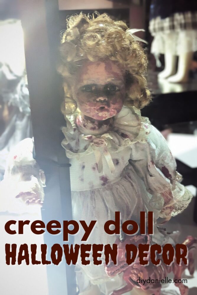 Second creepy doll Halloween decoration in a witch-themed or haunted setup, perfect for spooky displays.