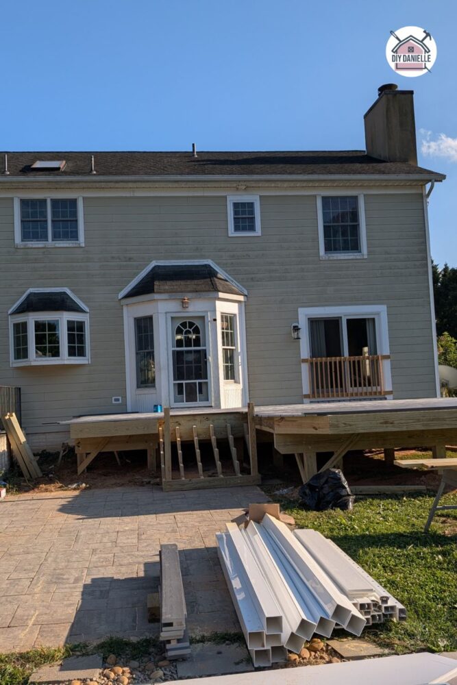 Deck materials laid out in the backyard ready for installation.