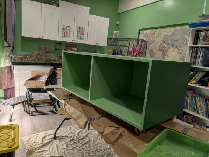 Reptile enclosure stand with casters installed before painting, making it easier to move and adjust the base during the build process.