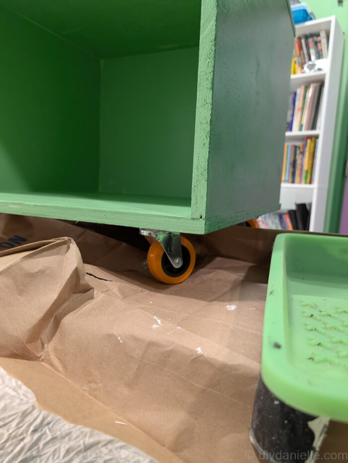 Wooden reptile enclosure stand showing the front edge where trim can be added for a finished, polished look.