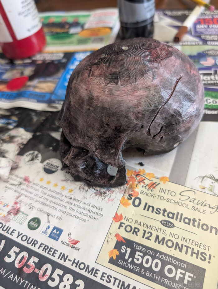 Top view of DIY skull baby mobile showing how the skull pieces are attached and hanging.