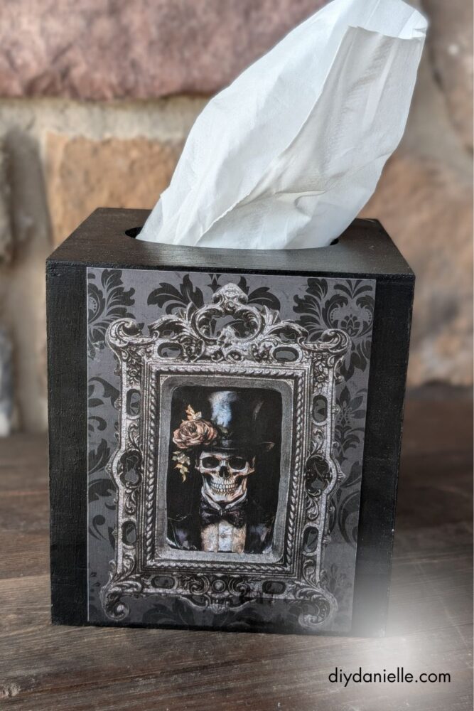 Assortment of craft materials including fabric, paper, and mod podge for upcycling projects.