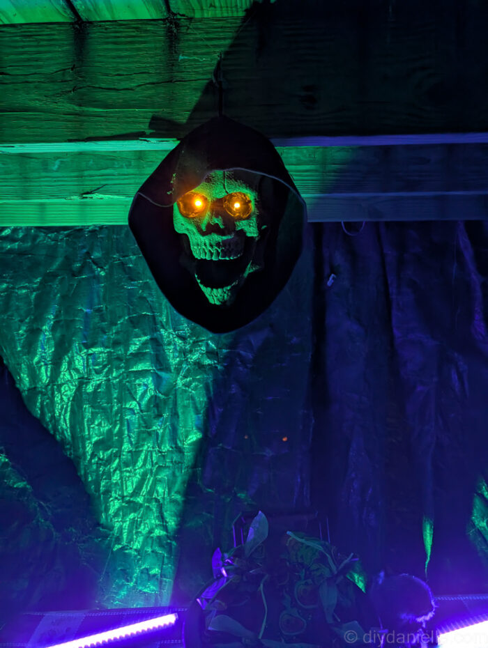 Nighttime view of the completed Halloween trail, featuring glowing lights and creepy décor.