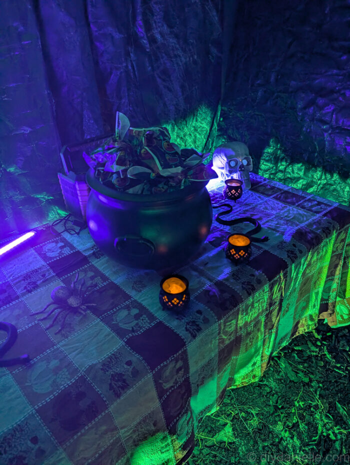 Nighttime view of the completed Halloween trail, featuring glowing lights and creepy décor.