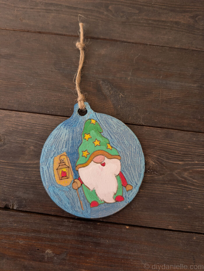 DIY ornament with string attached, ready to hang on a Christmas tree.