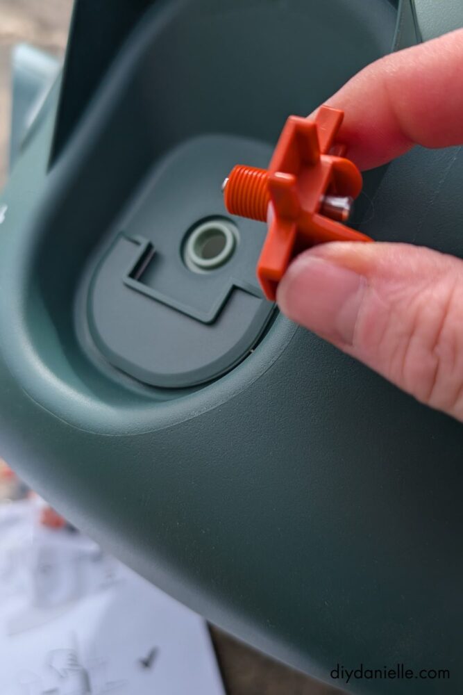 Assembling the Omlet insulated waterer by adding the nipple waterer.
