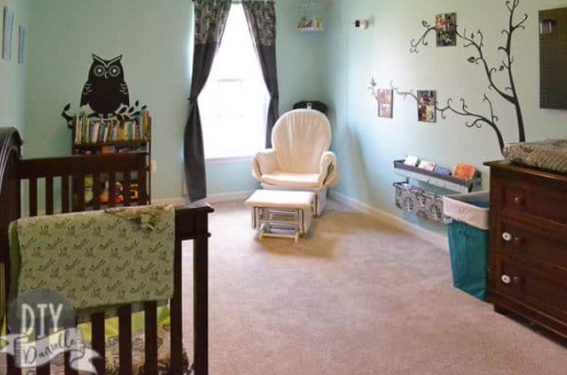 Nursery wall art and decor in a Tame Teal SW6757 room with framed prints, decorative accents, and coordinated colors.