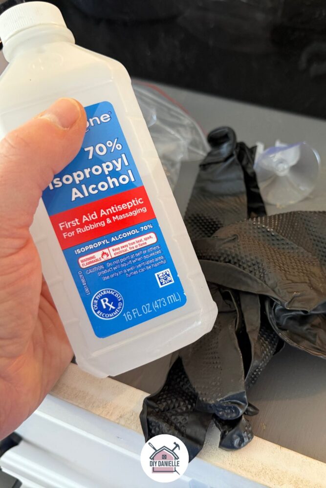 Isopropyl alcohol 70% and nitrile gloves, ready to use for sterilizing equipment for mushroom growing.