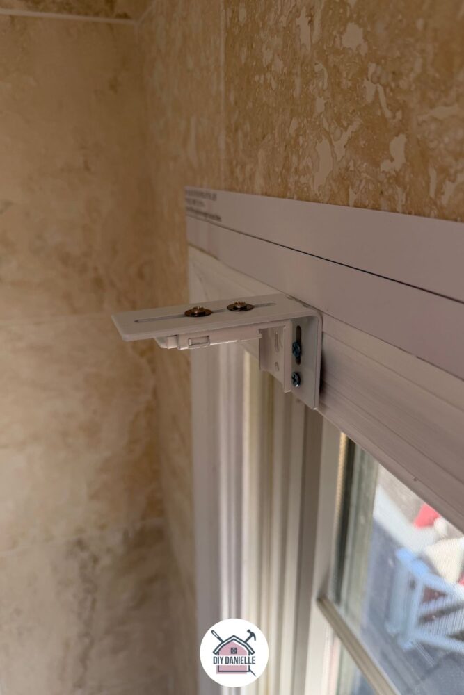 Now you can attach the bracket that the blinds snap onto to the longer bracket... this uses two bolts, two washers, and two nuts per bracket set. You can move the bracket around, depending on how far out that you want the blinds to sit. 