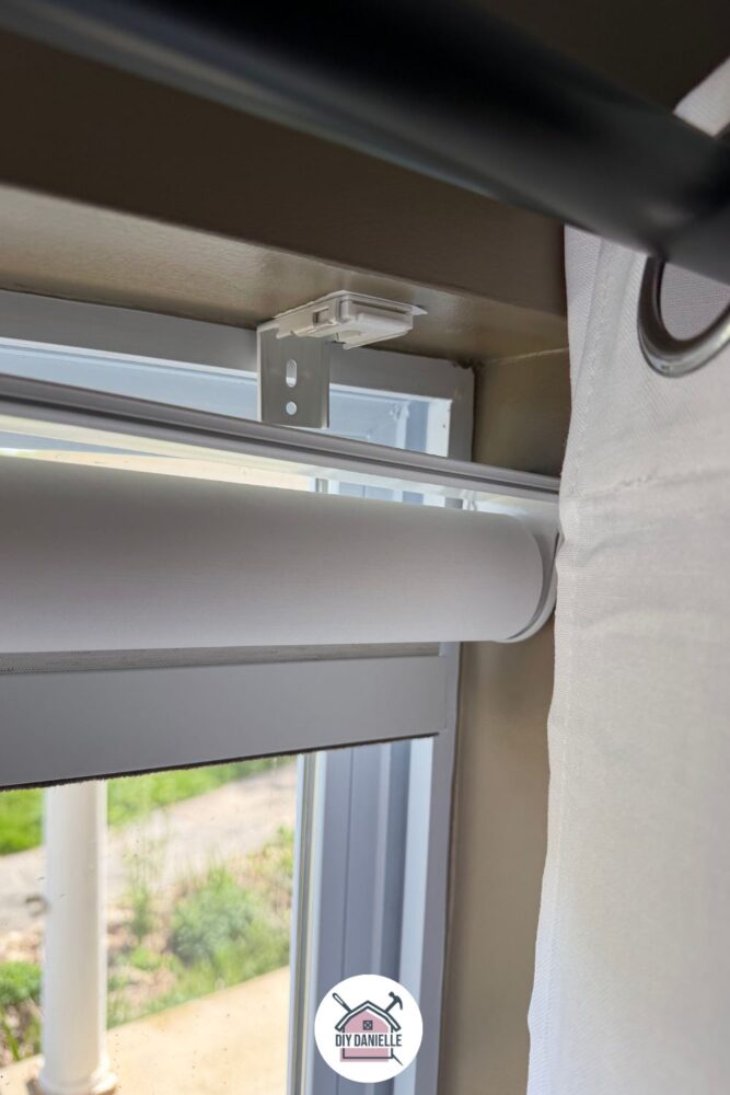 Attached bracket in the window before the smart blinds are snapped onto it. 